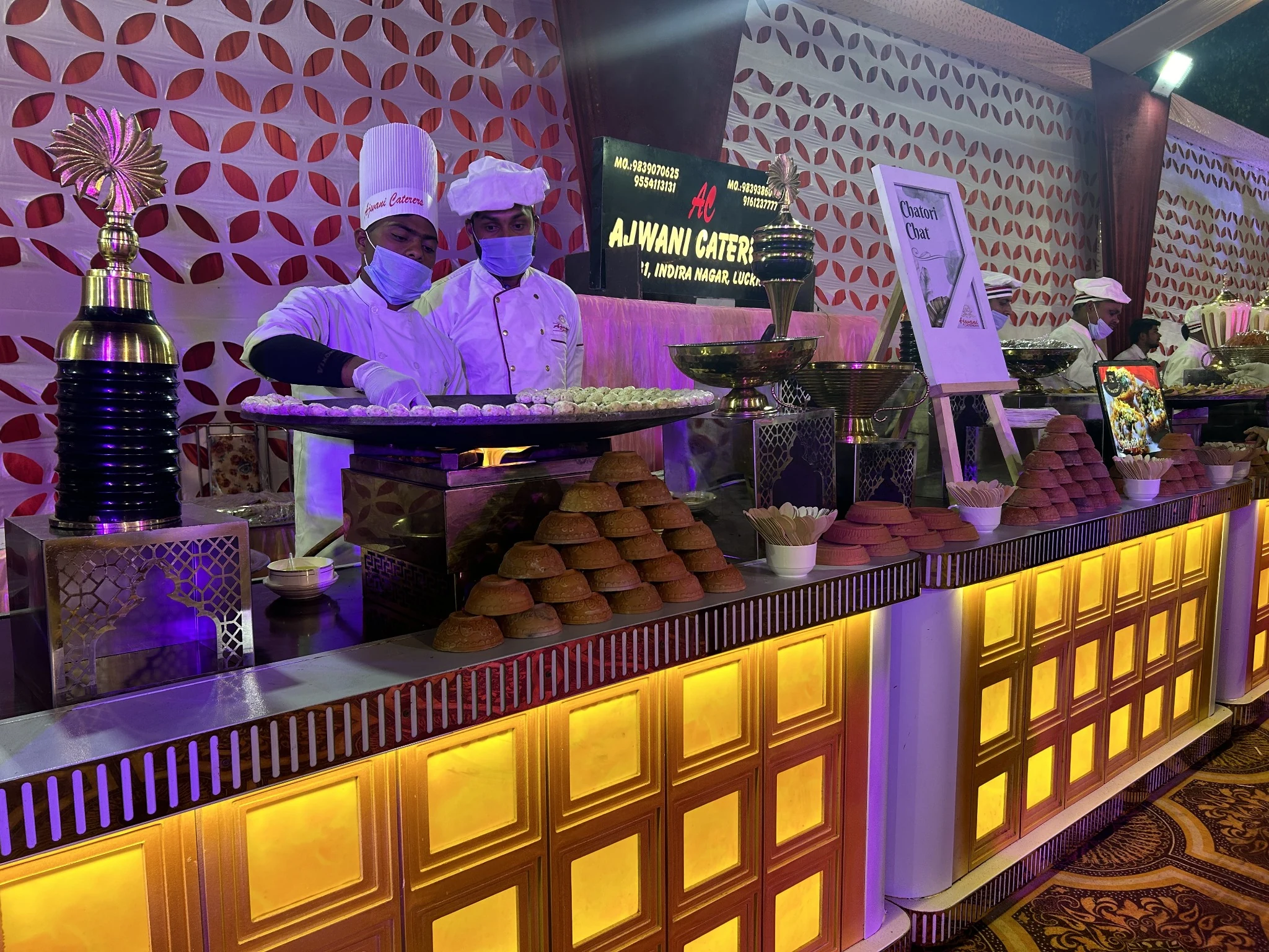 Ajwani Caterers illuminated chaat counter setup — hero slide 3